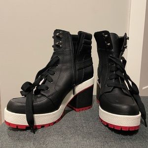 Black, red, and white laced heeled boots
